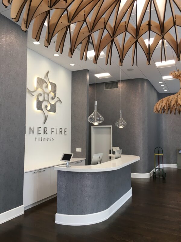 A pair of Sky-Fall pendants over the reception desk at Inner Fire Fitness