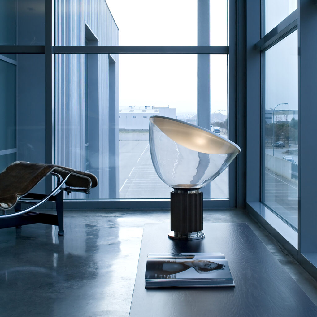 Flos Taccia table lamp by a window