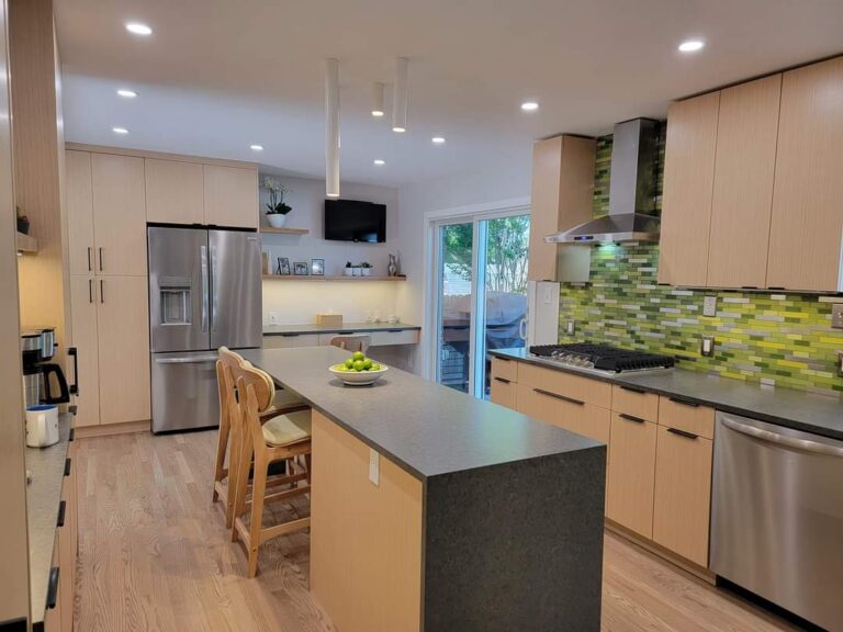 White A-Tube pendants over a family kitchen island