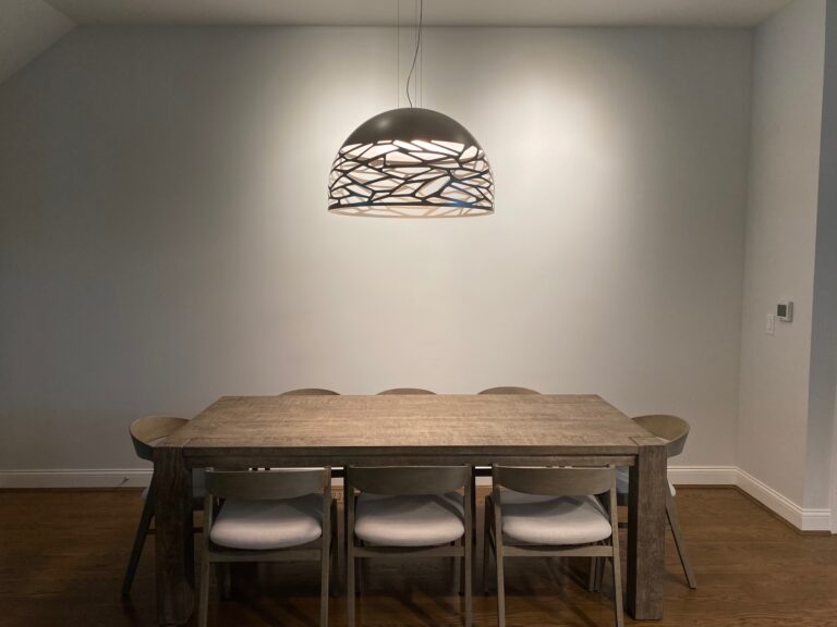 Kelly Dome 80 in matte champagne over a long dining table