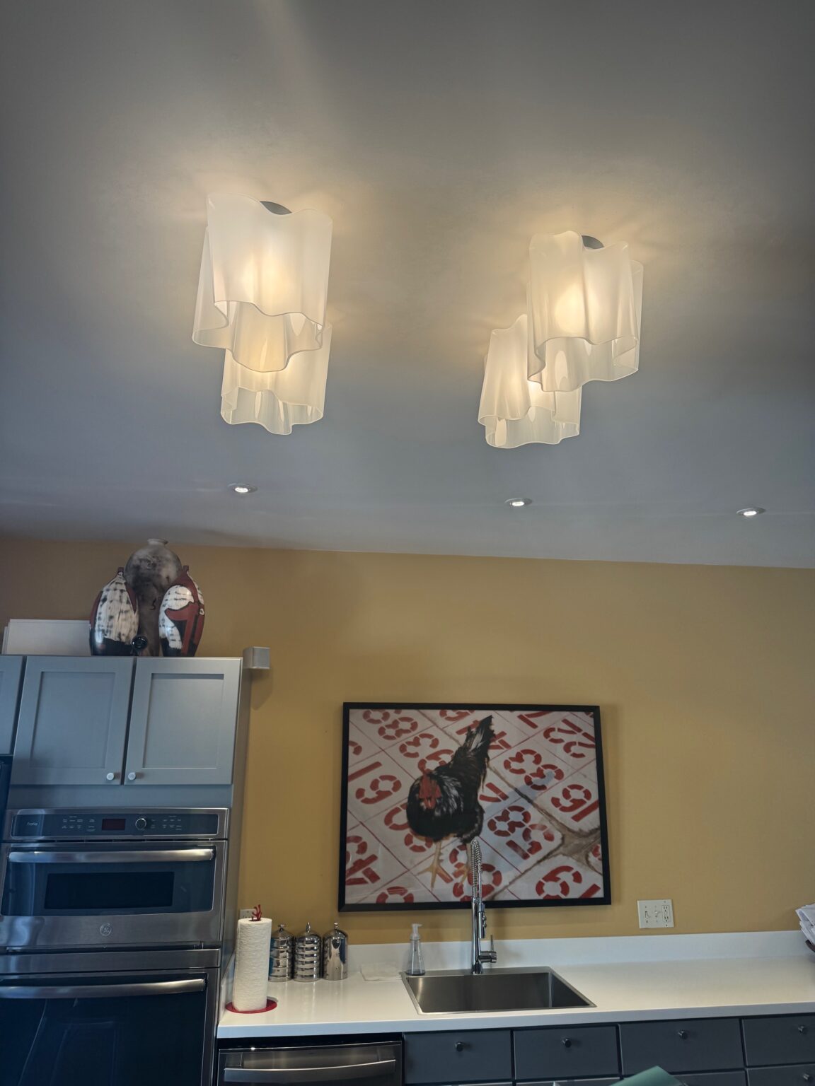 Artemide Logico ceiling lights over a kitchen