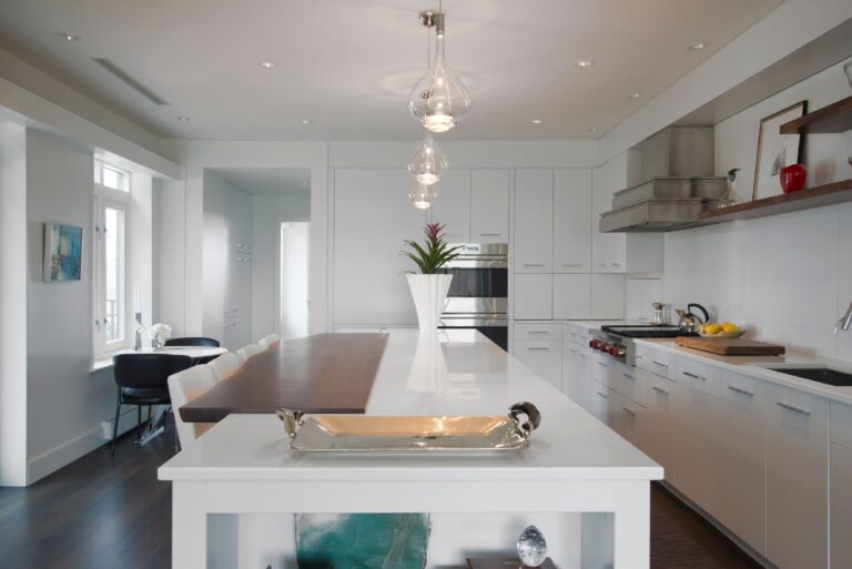Clear Sky-Fall pendants over a white kitchen island