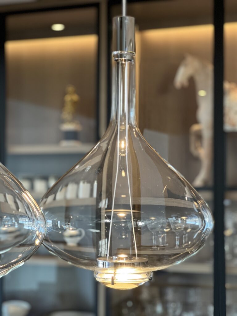 Detail of a clear Sky-Fall in front of lit shelving