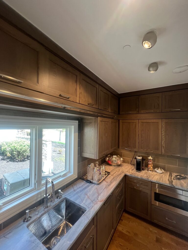 Champagne Spider ceiling spots in a walnut kitchen