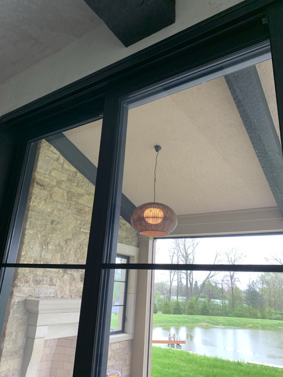 Bover Garota pendant hanging in a sunlit room with large windows