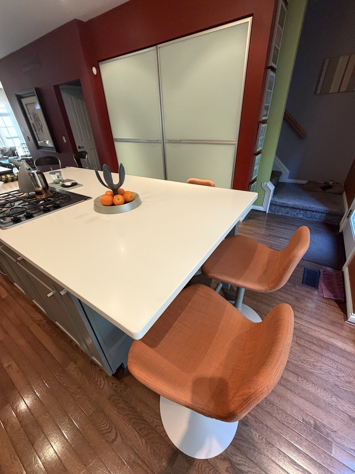 Overhead view of Midj Dalia stools tucked under a kitchen island overhang