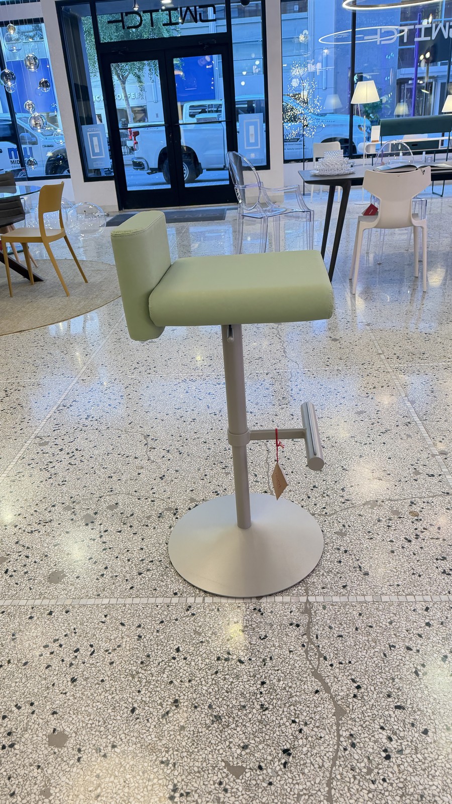 Midj Toy SG TS stool in pastel green faux leather on a Sand frame in the Switch showroom