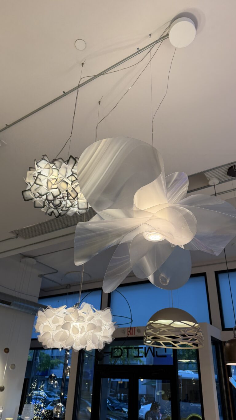 Slamp Étoile and Clizia pendants hanging in the Switch showroom
