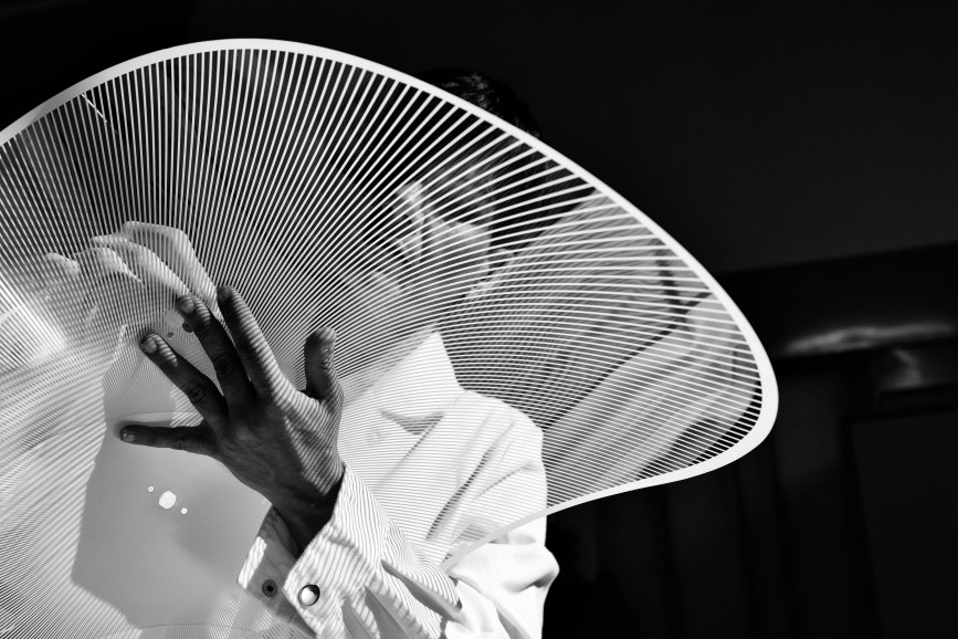 A Slamp artisan assembling a lamp by hand