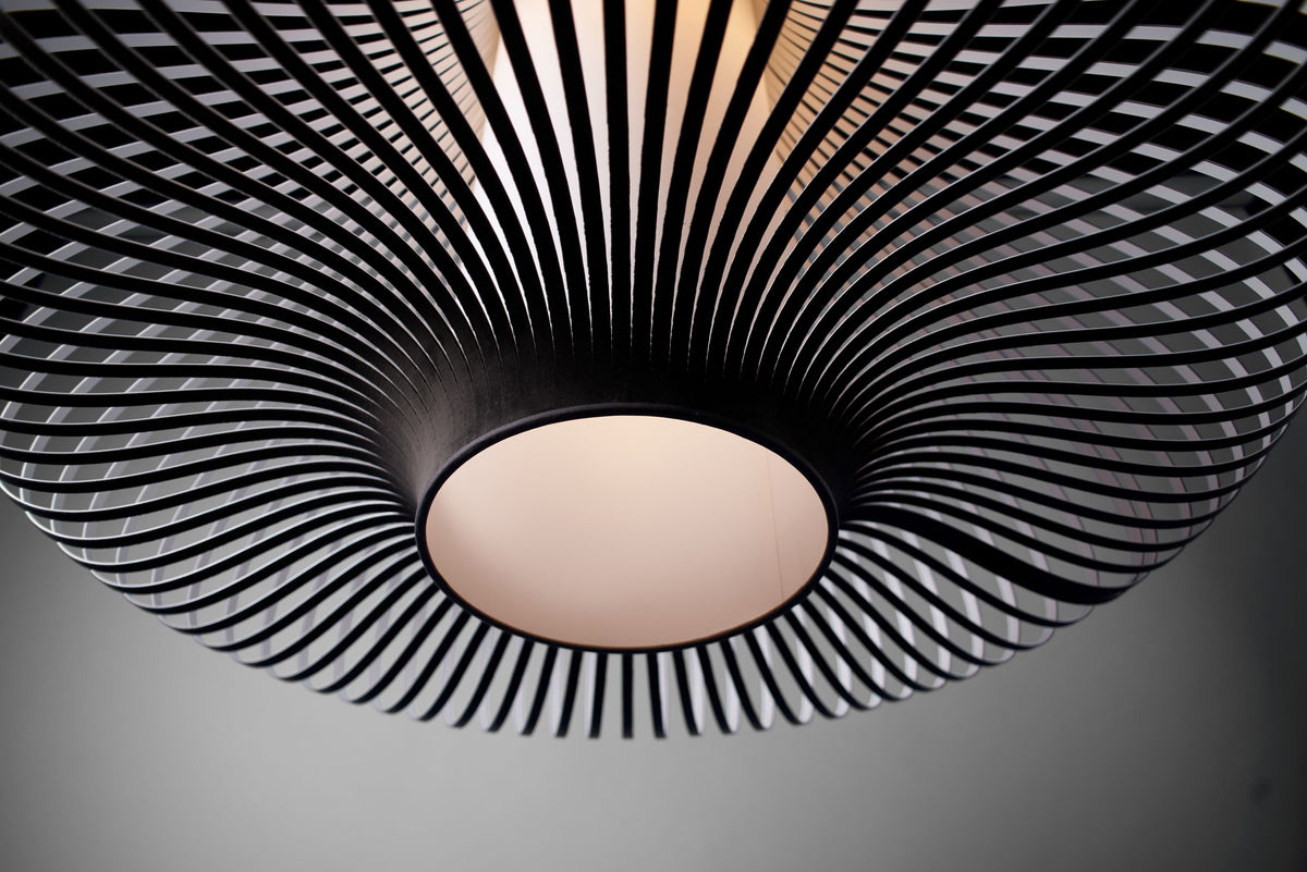Looking up into the Uplight Group Blossom XL pendant, velvet ribs radiating around the diffuser