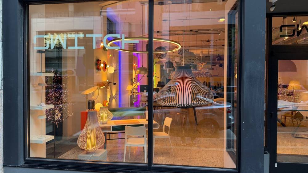 Switch Lighting & Design's 6th Street window in downtown Cincinnati with the Uplight Group Blossom XL Pendant and Blossom table lamps